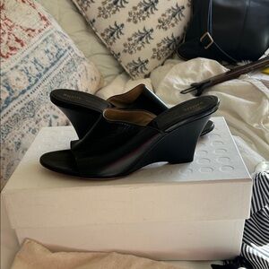 KHAITE Black Leather Wedge Slide Sandal